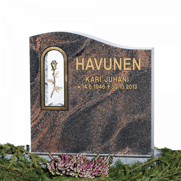 Punainen hautakivi, nimi ja päivämäärät.